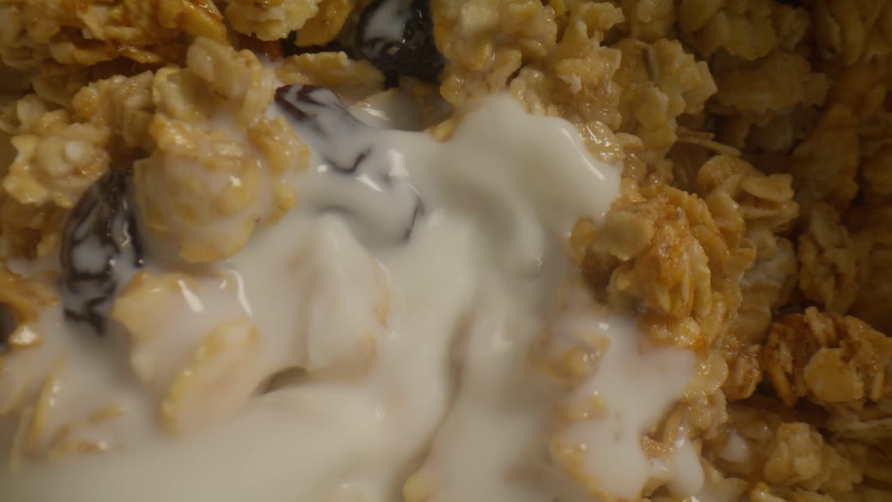 Macro Granola with milk pouring Spinning