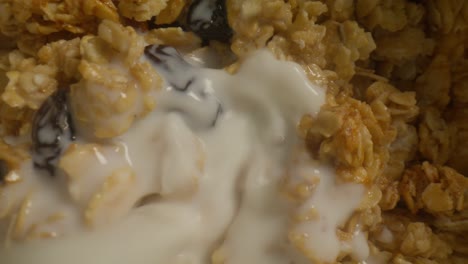 macro granola with milk pouring spinning