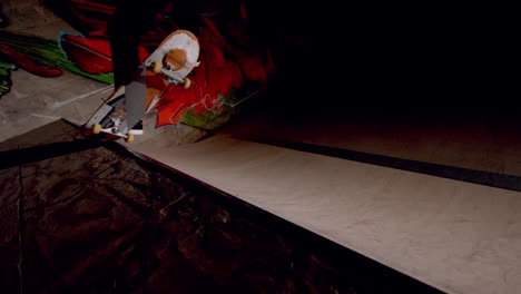 skater doing frontside 50 along top of ramp