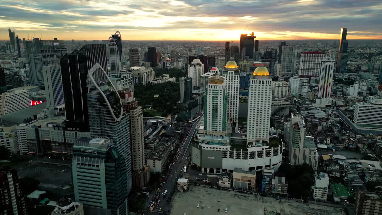 Aerial Drone Cityscape of Bangkok Thailand with Sunset Skyline Skyscrapers Thai Capital, Establishing Shot at Bang Rak business district