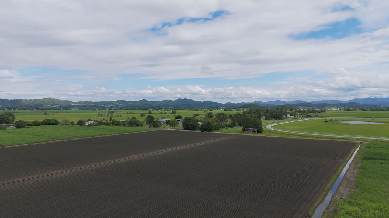 Expansive fields with mountains in the background