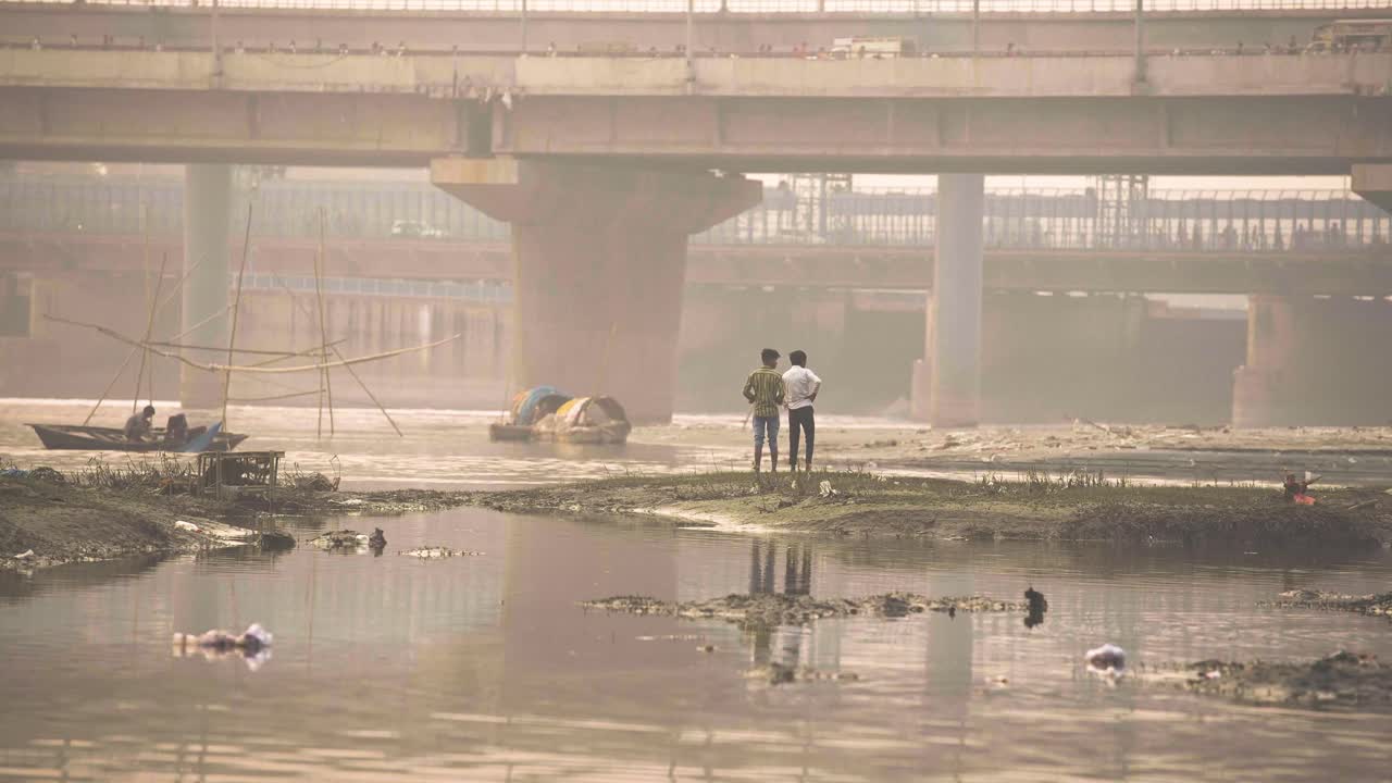 Boys standing at yamuna ghat delhi