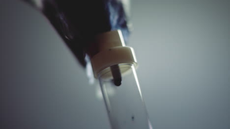 dark liquid is dripping slowly