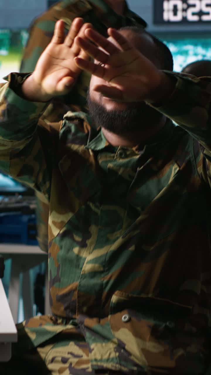 Vertical video Military officer using augmented reality tracking tech to gain intel