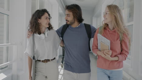 students walking through university corridor
