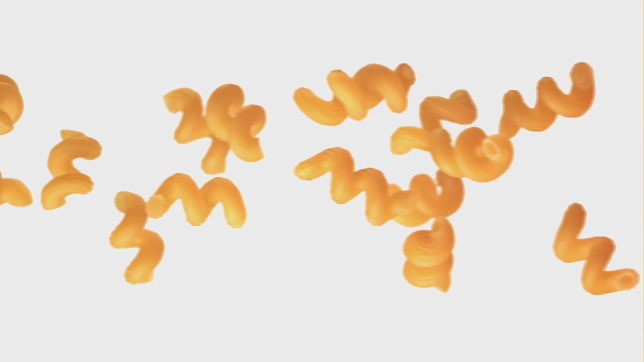Orange Spiral Pasta Floating on White Background