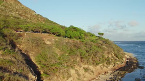 drone-footage-along-the-rocky-coast-of-Oahu-Hawaii-passing-Diamond-Head-Lighthouse-on-the-island-of-Oahu-in-the-Hawaiian-islands