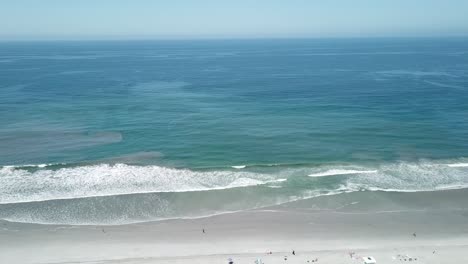 aerial view from a drone flying over the coast to the sea