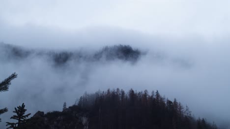 slow drifting autumn fog over mountains in triglav slovenia