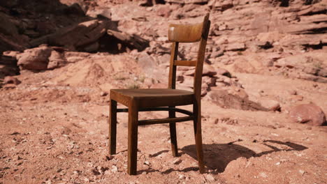 old wooden chair on rocks of grand canyon