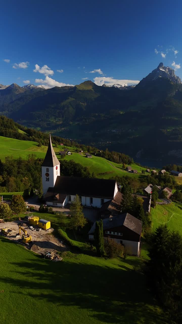 Amden village Switzerland simple countryside living Swiss alpine nature aerial drone vertical