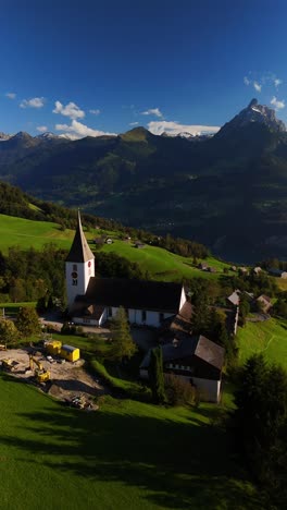 amden village switzerland simple countryside living swiss alpine nature aerial drone vertical