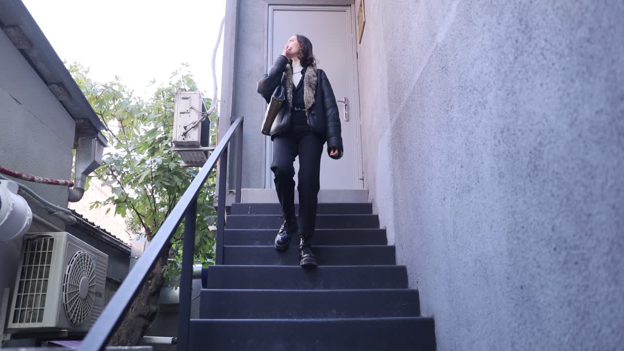 Woman in urban setting on stairs