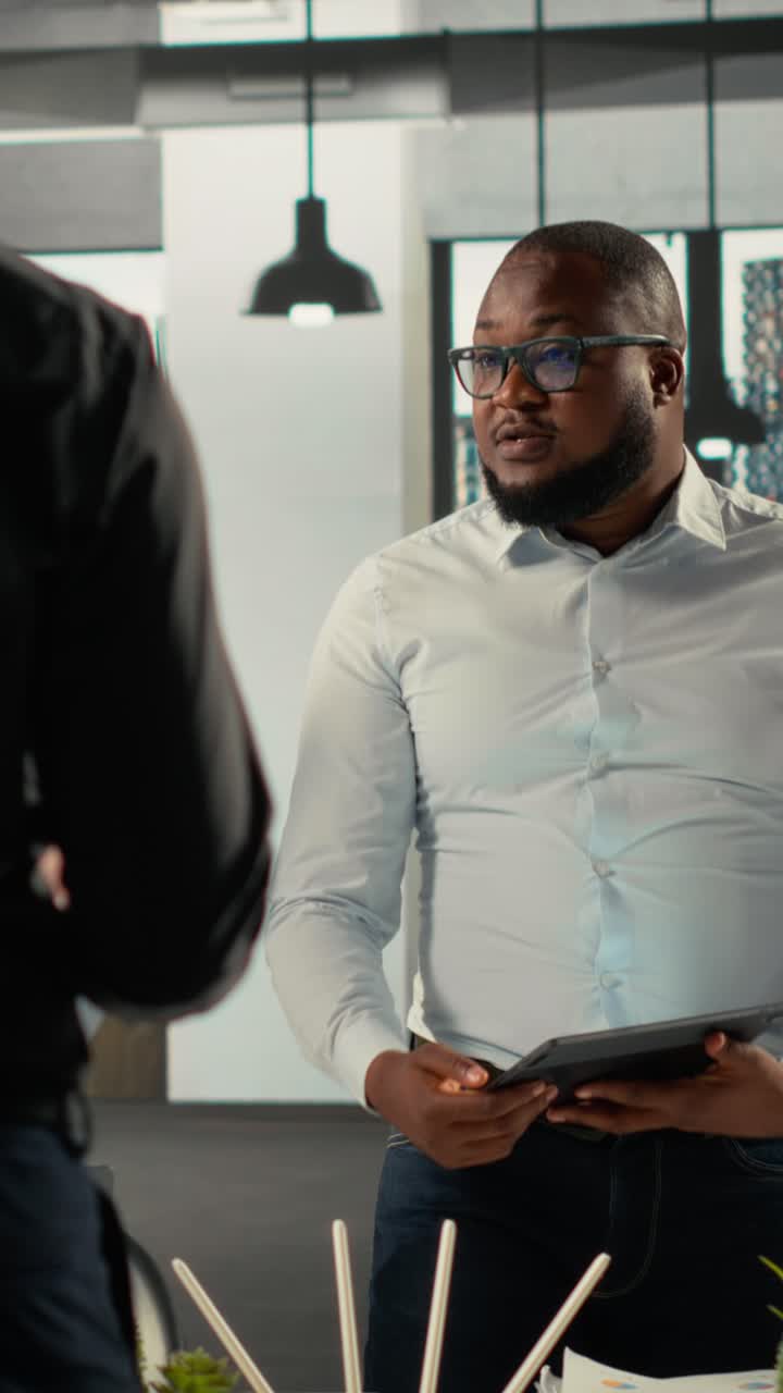 Vertical Video Professional staff analyzing finance numbers and corporate documents
