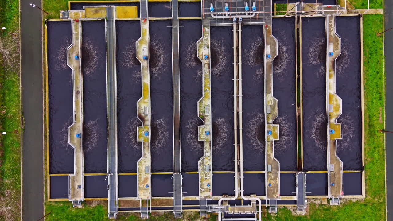 Water treatment facility processes large amounts of wastewater in an industrial setting during daylight hours