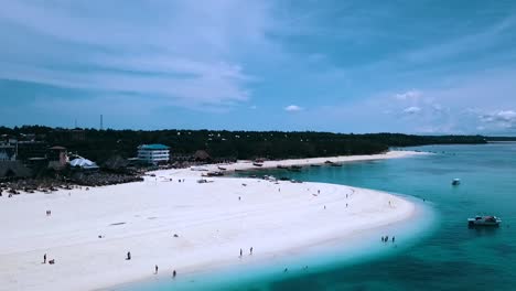 Smooth-aerial-flight-over-crystal-clear-turquoise-water-dream-white-sand-beach