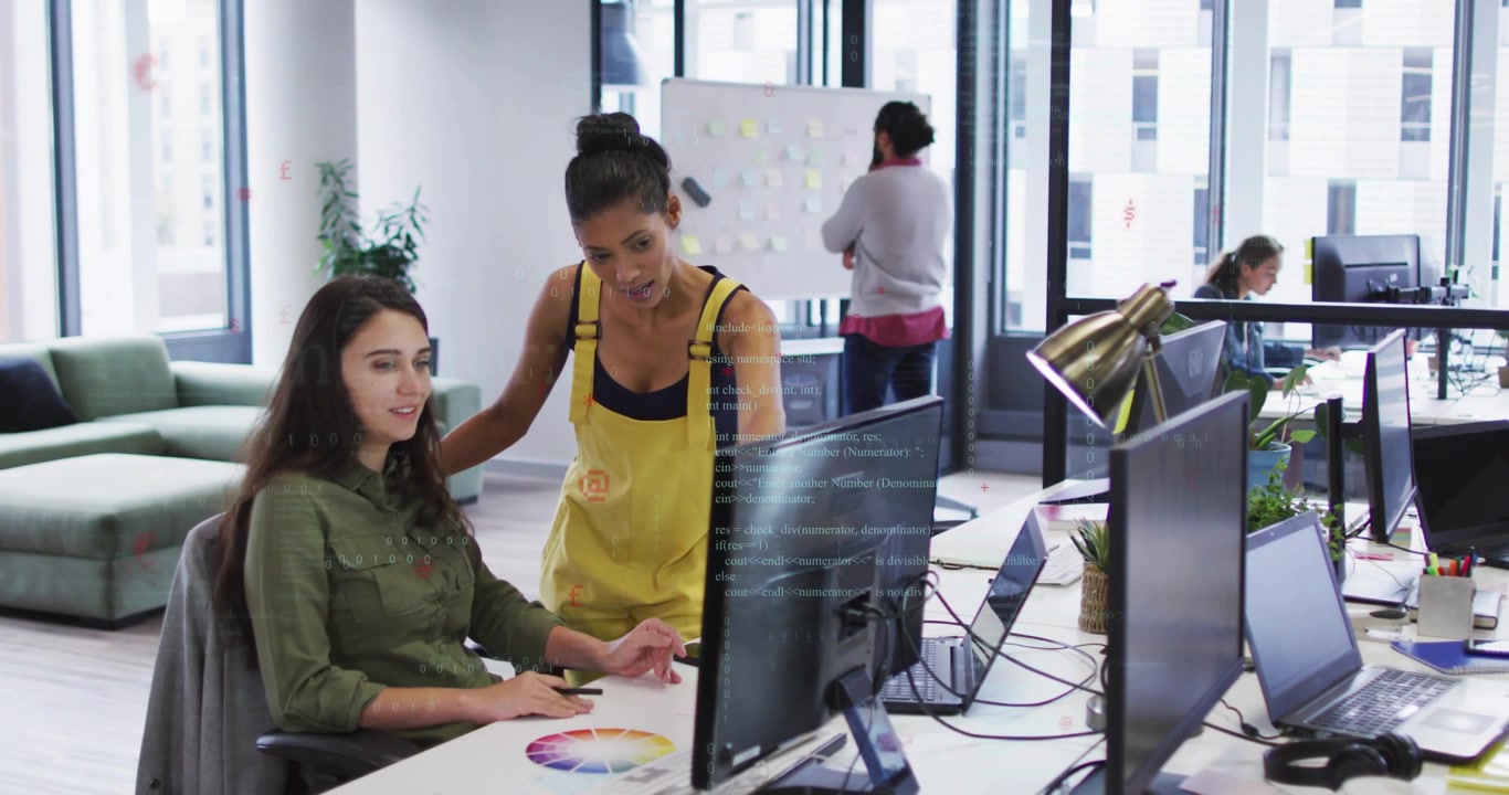Graphic designer sketching color wheel when colleague stepping in guiding color tweaks for project
