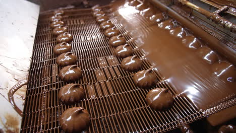 chocolate coating marshmallows on a production line
