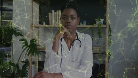 Animation-of-data-processing-over-african-american-female-doctor