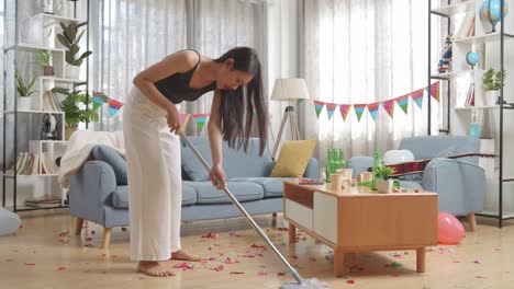 woman cleaning up after a party