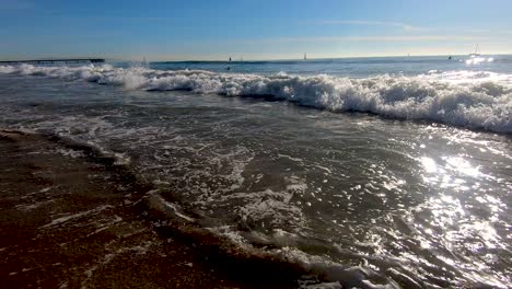 Ocean-wave-crashes-into-surfer-in-slow-motion-at-Venice-Beach-in-LA-in-daytime