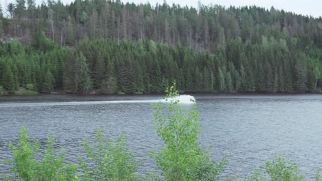 Following-view-of-a-man-speeding-on-a-Jet-Ski-on-the-lake-in-Norway