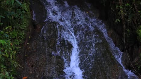 Water-running-downward-across-some-rocks-that-are-formed-into-perfect-levels