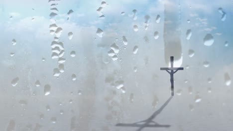 Animation-of-Christian-cross-casting-shadow-seen-through-glass-with-water-drops-