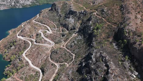 Serpentine-winding-road-switchbacks-lead-up-to-Green-Canyon,-Taurus-mountains-Turkey