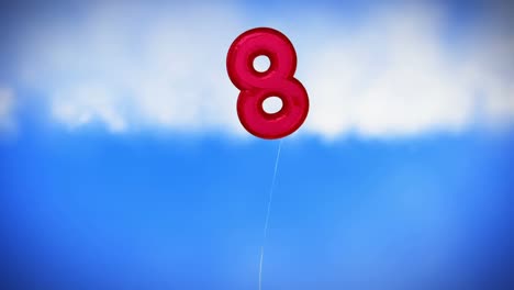 red colored balloon in the form of eight