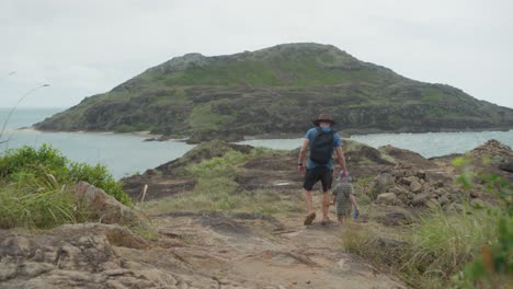 the landscape at the northernmost point of australia, known as pajinka, or the tip, in cape york. a man and his son are exploring. clip 1