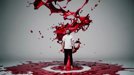 man in red paint splashes