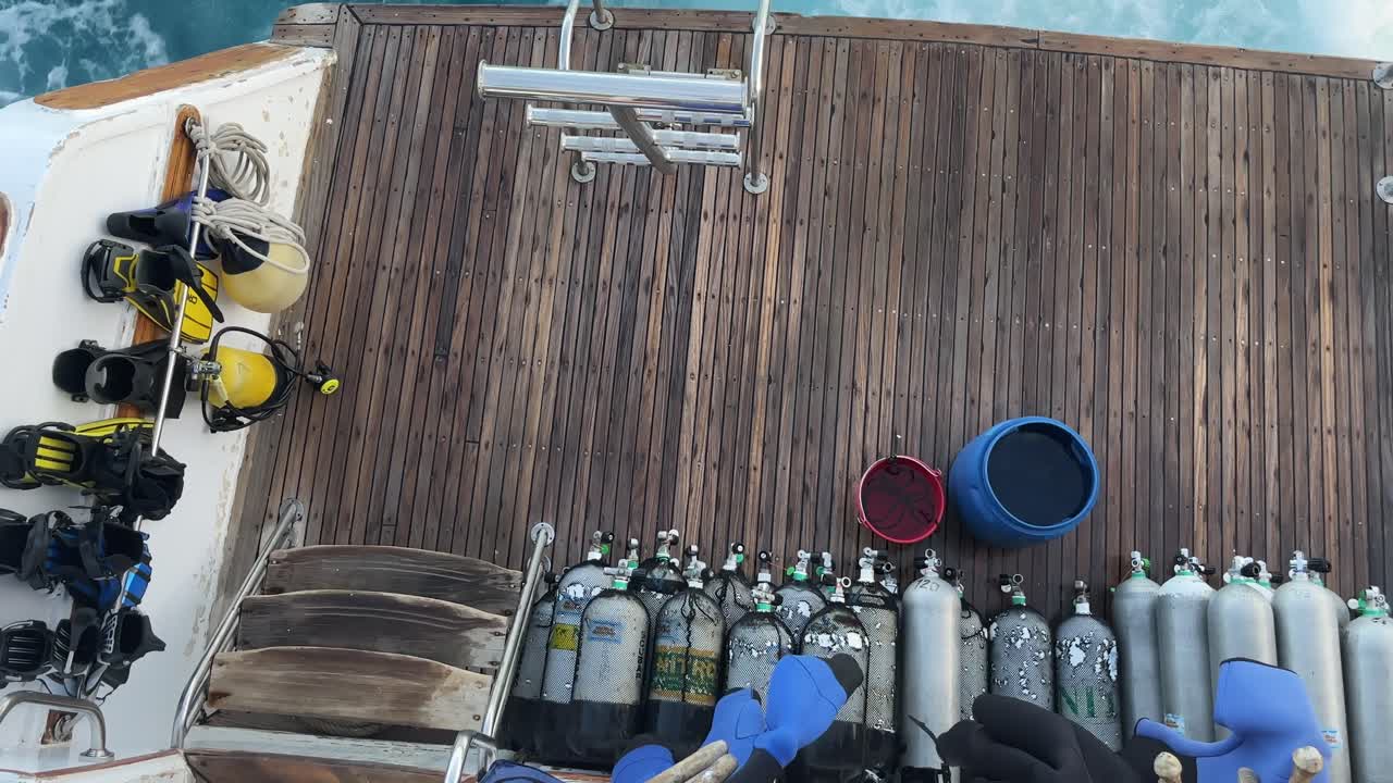 Diving equipment neatly arranged on boat deck in Egypt, ready for underwater adventure