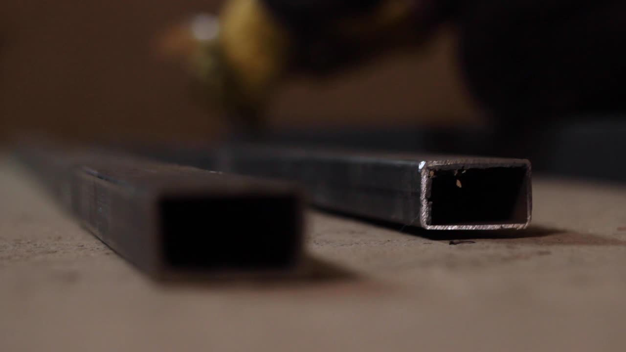 Steel fabrication frame markings being made on table, closeup