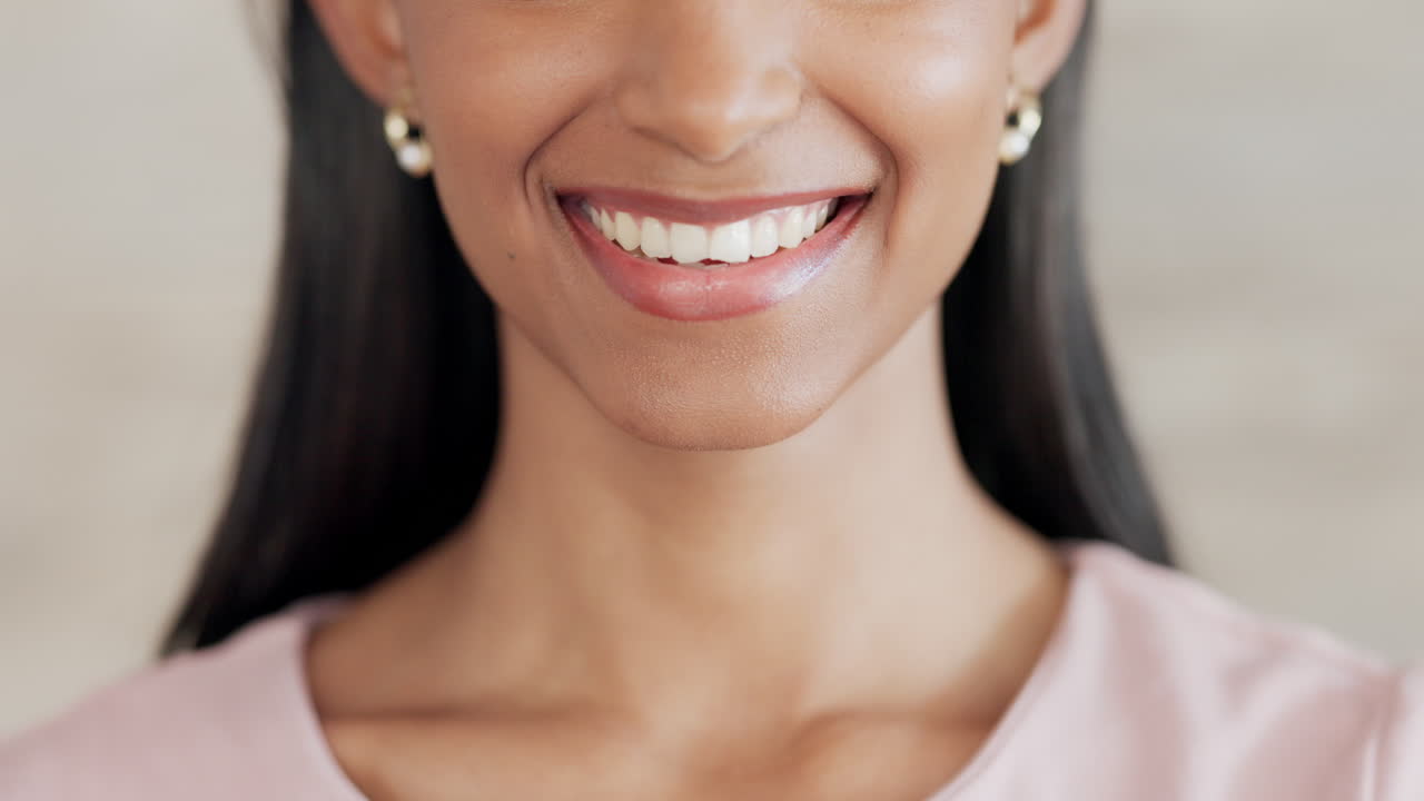 Lady with clean teeth smiling after her dentist