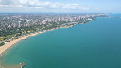 Aerial-Skyline-view-of-downtown-Chicago-North-avenue-beach-and-buildings-surrounding-it-on-a-nice-sunny-day-in-the-summer