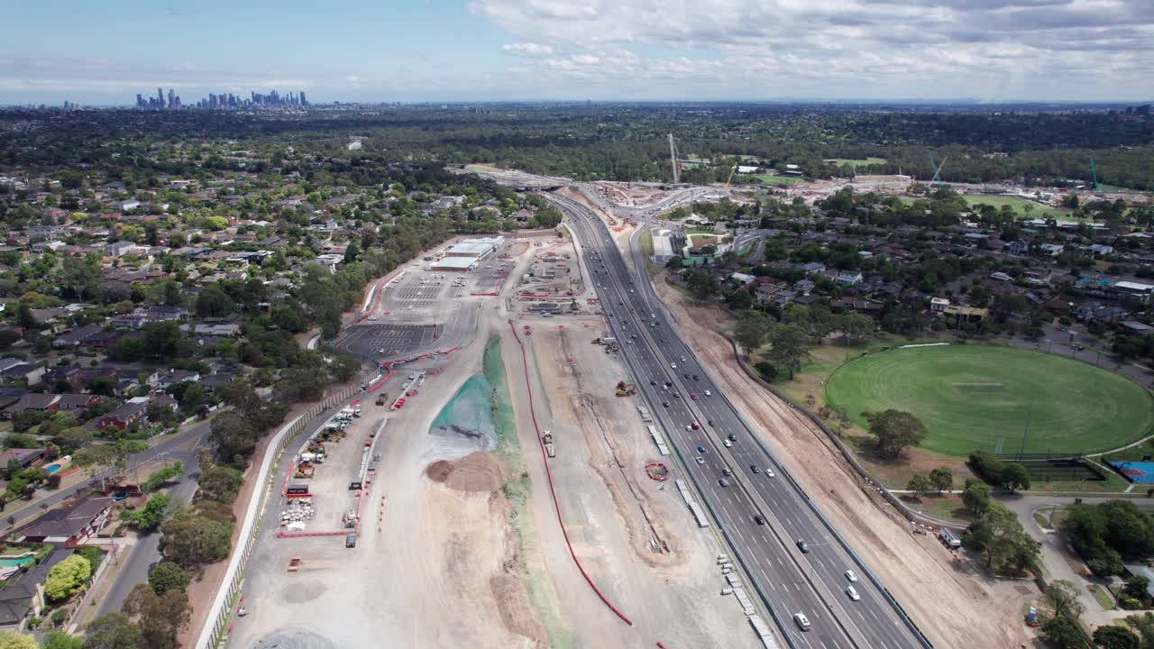 Aerial view looking north west along the Eastern Freeway towards the Bulleen Road intersection during construction of the North East Link project in February 2025, Victoria, Australia.