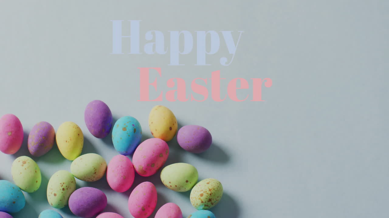 Animazione del testo 'Buona Pasqua' su uova di Pasqua colorate su sfondo grigio.
