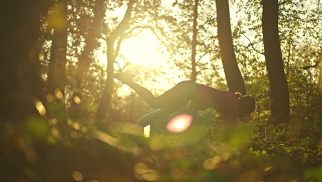woman practicing yoga in a serene forest at golden hour