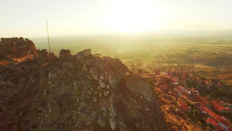 aerial view of a hilltop village at sunset