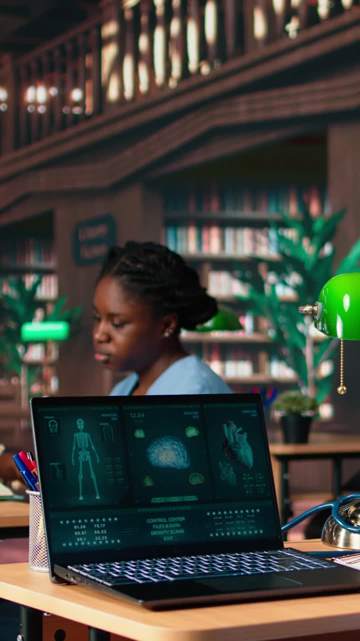 Medical Student Analyzing Human Anatomy Data on Laptop