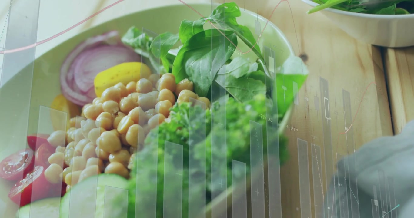 La telecamera si sposta a sinistra, zoomando indietro e rivelando un'insalata di ceci, mentre deboli barre mostrano i valori nutrizionali