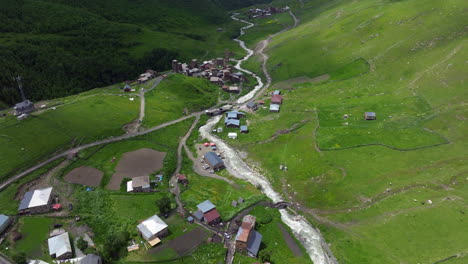 Enguri River Flowing Through Town Of Ushguli Remote Village In Svaneti, Georgia. Aerial Drone Shot