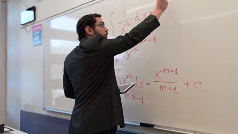 modern educator using a tablet while teaching math