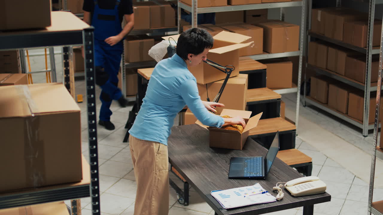 Woman Packing Items in Warehouse