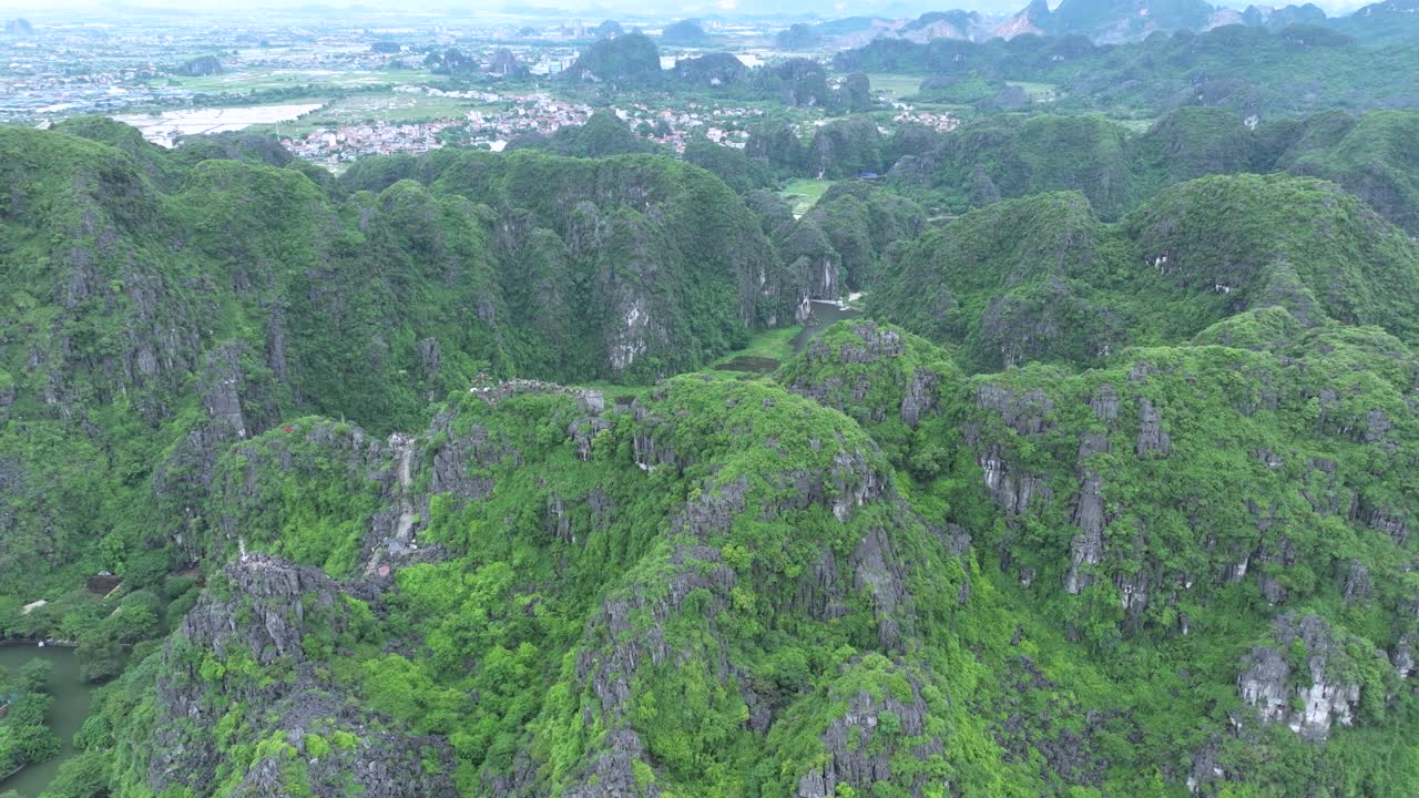 Lush green karst mountains in ninh binh, vietnam on a cloudy day, aerial view