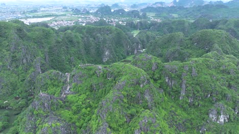 lush green karst mountains in ninh binh, vietnam on a cloudy day, aerial view