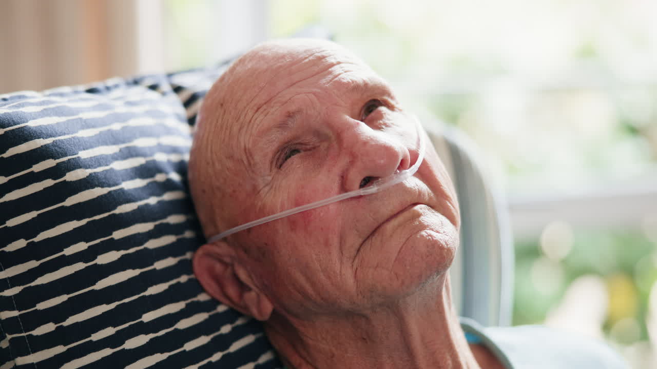 Elderly man with oxygen tube