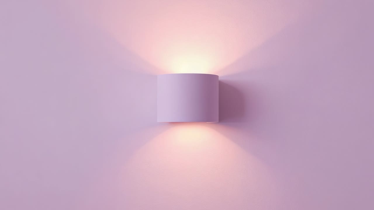 Receiving power, cylindrical sconce casting beams across studio pink wall, creating soft shadows