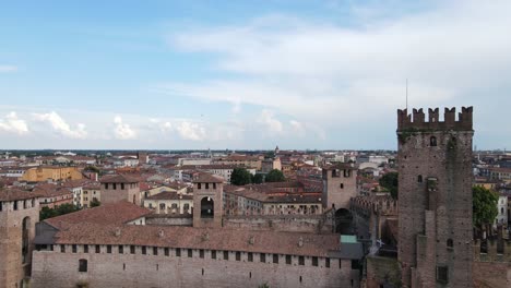 drone flight over the castelvecchio bridge with final view of verona city - italy